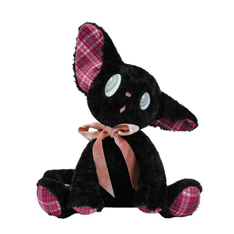 Entzückendes lauschendes Kätzchen-Plüschtier